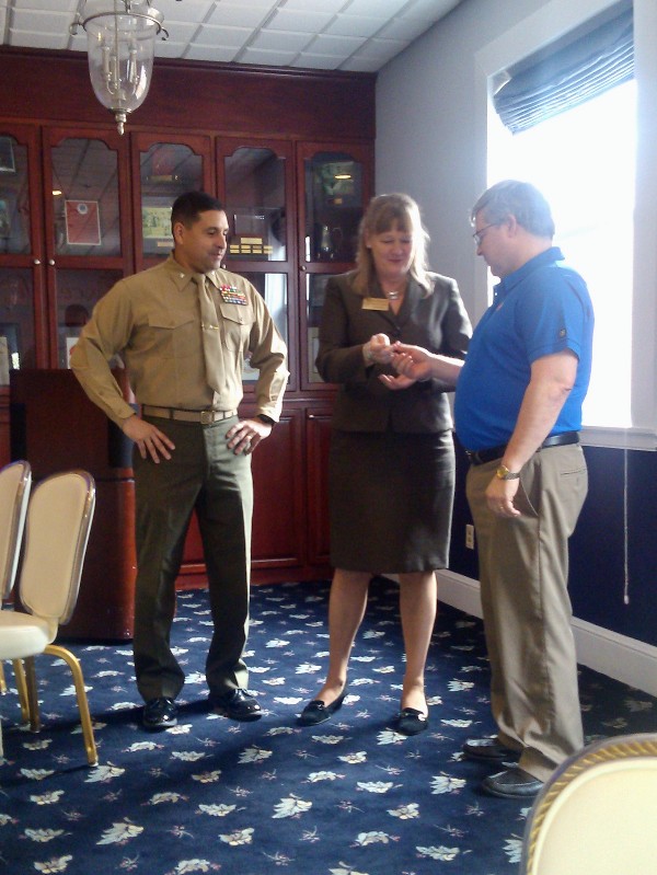 At the February planning session, Jane Brightwell, regional vice president, presents an AFCEA International coin to Dan Egge, chapter treasurer, in recognition of his dedication to AFCEA as Col. Delgado stands by.